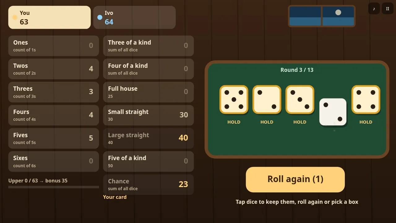 Five dice on a green felt tray with a scoring card of thirteen boxes on the left