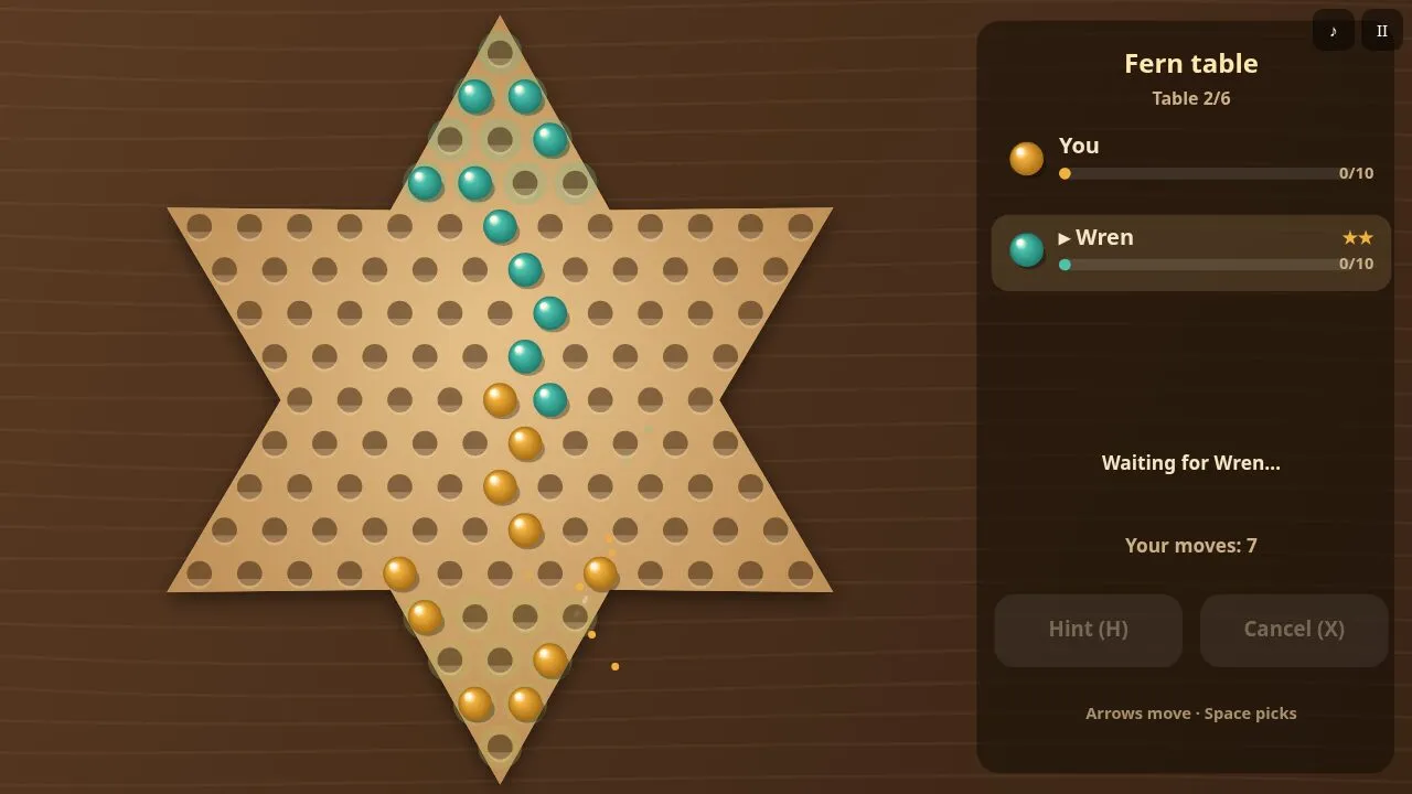 The oak star board with amber and teal marbles and glowing holes for a picked marble