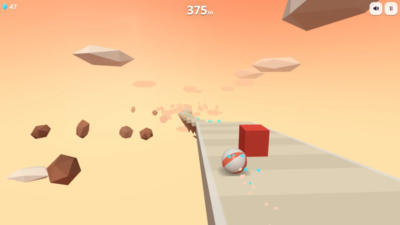 Ridge Roller in play: a striped ball rolls down a sky track past a red block