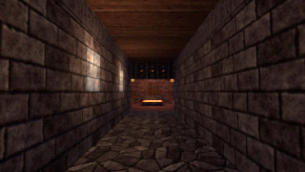 A corridor of stone block walls with a flagstone floor and a wooden ceiling