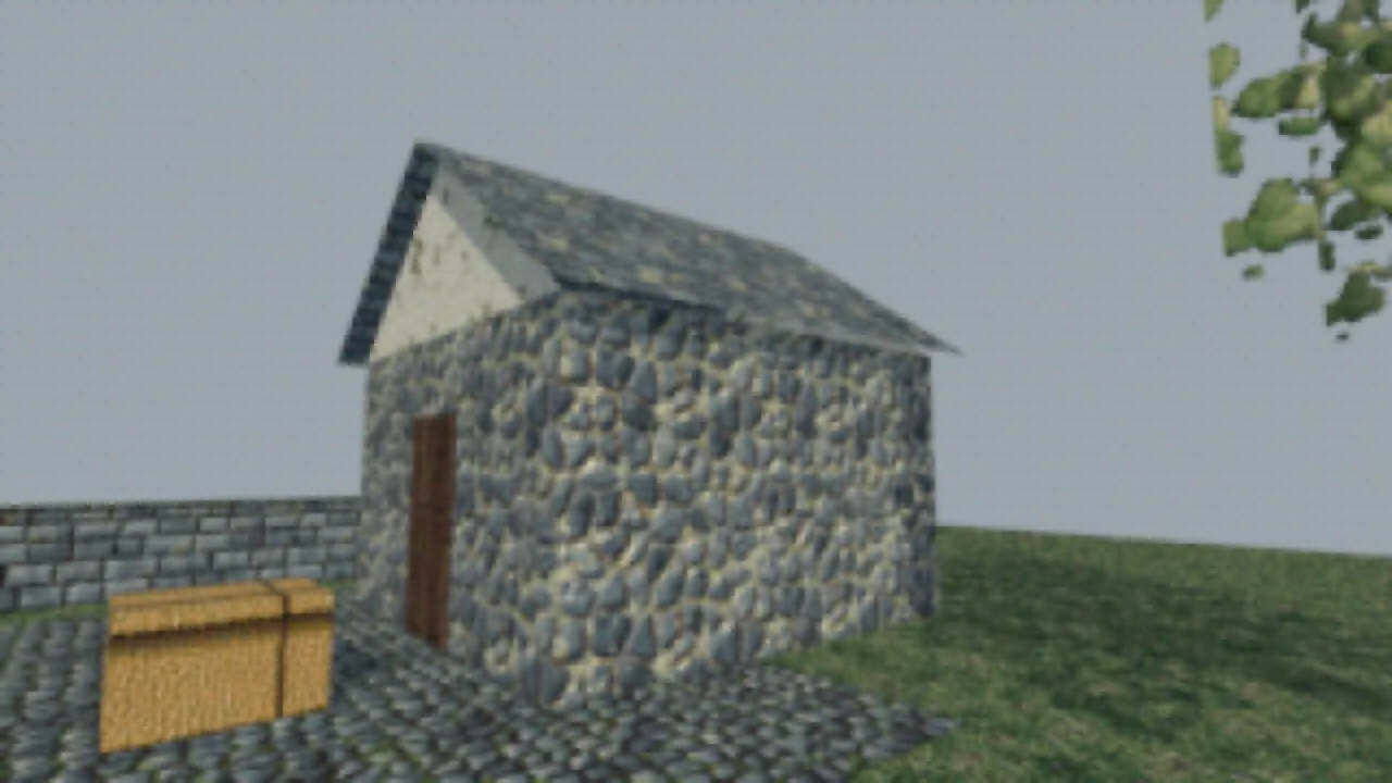 A fieldstone cottage with a slate roof and a straw bale on a cobbled yard